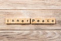 Inner peace word written on wood block. inner peace text on table, concept Royalty Free Stock Photo