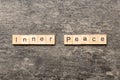 inner peace word written on wood block. inner peace text on table, concept Royalty Free Stock Photo