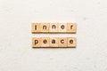 inner peace word written on wood block. inner peace text on table, concept Royalty Free Stock Photo