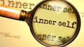 Inner self and a magnifying glass on English word Inner self to symbolize studying, examining or searching for an explanation and