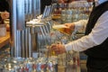 an innkeeper fills beer glasses at the bar