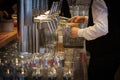 an innkeeper fills beer glasses at the bar