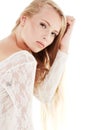 Innocent Allure. Portrait of a beautiful young woman in a white dress. Royalty Free Stock Photo