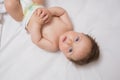 Innocent baby lying in crib Royalty Free Stock Photo