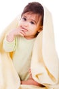 Innocent baby wrapped with a yellow towel Royalty Free Stock Photo