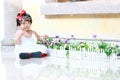 Innocent Chinese baby girl play bubbles in a garden Royalty Free Stock Photo