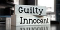 Innocent, guilty - words on wooden blocks