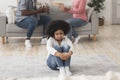 Innocent little african american girl suffering from family conflicts Royalty Free Stock Photo
