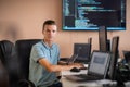 Innovating the Future: A Young Programmer Testing New Smartphone Apps in the Office.