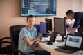 Innovating the Future: A Young Programmer Testing New Smartphone Apps in the Office.