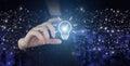 Innovation, brainstorming, inspiration and solution concepts. Hand hold digital hologram light bulb sign on city dark blurred Royalty Free Stock Photo