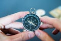 Innovation concept: Man is holding a compass in his hand, closeup cutout Royalty Free Stock Photo