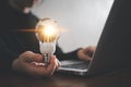 Innovation design concept. Hand holding light bulb for new idea brain storming creative inspiration Royalty Free Stock Photo