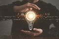 Innovation design concept. Hand holding light bulb for new idea brain storming creative inspiration Royalty Free Stock Photo