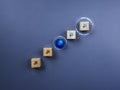 Innovation technology network concept. Arrow up icon on wooden blocks stacking as chart step connected with blue cube block.