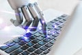 Innovation technology robot hands fingers point to laptop button advisor chatbot robotic artificial intelligence concept Royalty Free Stock Photo