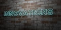 INNOVATIONS - Glowing Neon Sign on stonework wall - 3D rendered royalty free stock illustration