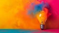 Innovative Blast: Vibrant Paint Splatter from Bulb. Creative colored light bulb explosion with shards and paint, a creative idea. Royalty Free Stock Photo