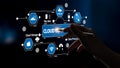 Innovative cloud computing concept with hand interacting with digital holographic icons representing data management Royalty Free Stock Photo