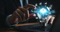 Innovative cloud technology solutions light bulb concept on laptop and businessman using it Royalty Free Stock Photo