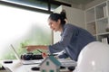 Innovative Engineer Communicating Insights via Radio in a Dynamic Office Environment
