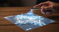 Innovative futuristic technology hand projecting interactive holographic map display with glowing lines on wooden surface Royalty Free Stock Photo