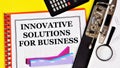 Innovative solutions for business. Text label in the planning notebook.