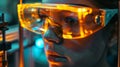 An innovators goggles reflecting the glow of a 3D printer in action