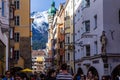 The Goldenes Dachl is a landmark structure seen at the end of a busy street located in the Old Town section of Innsbruck, Austria