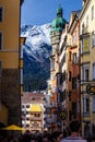 The Goldenes Dachl is a landmark structure seen at the end of a busy street located in the Old Town section of Innsbruck, Austria