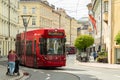 Innsbruck, Austria - April 17th 2018: A red coloured tram passing the historic buildings at Marktgraben