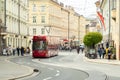 Innsbruck, Austria - April 17th 2018: A red coloured tram passing the historic buildings at Marktgraben