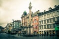 Innsbruck Austria street scene on a rainy foggy day.