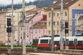 Innsbruck railway station and multicolored houses facades. Austrian transportation