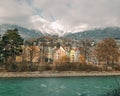 Innsbruck, Tirol/Austria - December 2 2017: the river Inn and colored houses at the bank of the river Royalty Free Stock Photo