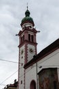 Innsbruck, Tirol/Austria - March 27 2019: Church tower with white and pink colors