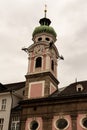 Innsbruck, Tirol/Austria - March 27 2019: Pink colored church tower