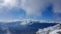 Innsbruck, Tirol/Austria - September 21 2017: Distant snowy high mountain peaks in the clouds near Innsbruck Royalty Free Stock Photo