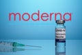 Inoculation Syringe and Covid Vaccine with Moderna Logo Royalty Free Stock Photo