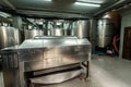 Inox wine barrels stacked in modern winery cellar in Spain Royalty Free Stock Photo