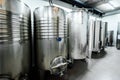 Inox wine barrels stacked in modern winery cellar in Spain Royalty Free Stock Photo