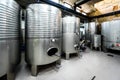 Inox wine barrels stacked in modern winery cellar in Spain Royalty Free Stock Photo