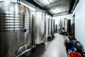 Inox wine barrels stacked in modern winery cellar in Spain Royalty Free Stock Photo