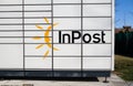 InPost logo sign on Paczkomat smart electronic steel parcel locker.