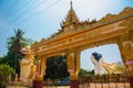 The input gate. Mya Tha Lyaung Reclining Buddha. Sculptures of mythological animals at the entrance. Chinthe. Bago. Myanma.