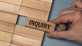 INQUIRY word concept. Close-up wooden piece blocks on the table