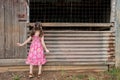 Inquisitive girl exploring old shed