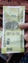 20 INR note held in hand