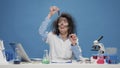 Insane foolish female chemist working with microscope in studio Royalty Free Stock Photo