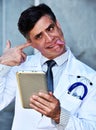 Insane Male Doctor With Tablet Royalty Free Stock Photo